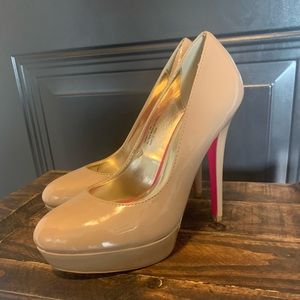 5 inch nude stilettos with pink bottoms! Worn once but they are a size too big.